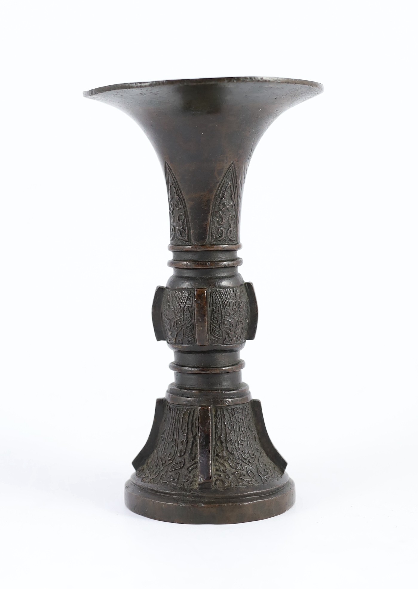A Chinese archaistic bronze beaker vase, gu, Ming dynasty, 19.2cm high